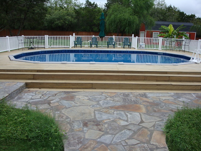 Above Ground Pool Companies
 Oval above ground pool with deck Traditional Pool