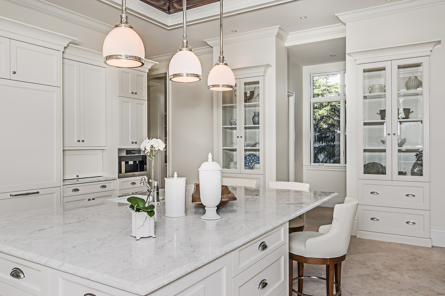 All White Kitchen
 Using Cabinetry To Make An All White Kitchen Interesting