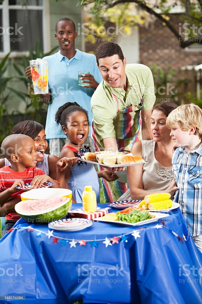 Backyard Cook Out
 Two Families At Backyard Cookout Stock Download