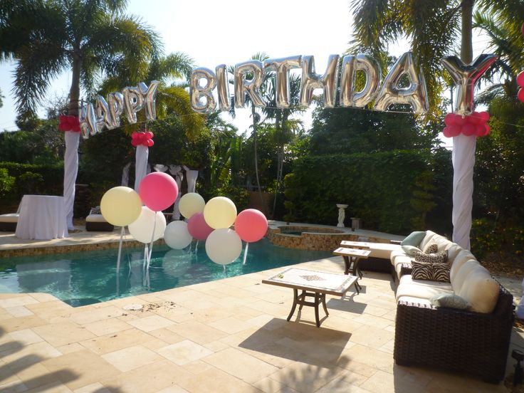 Backyard Pool Party
 Birthday balloon arch over a swimming pool Backyard party