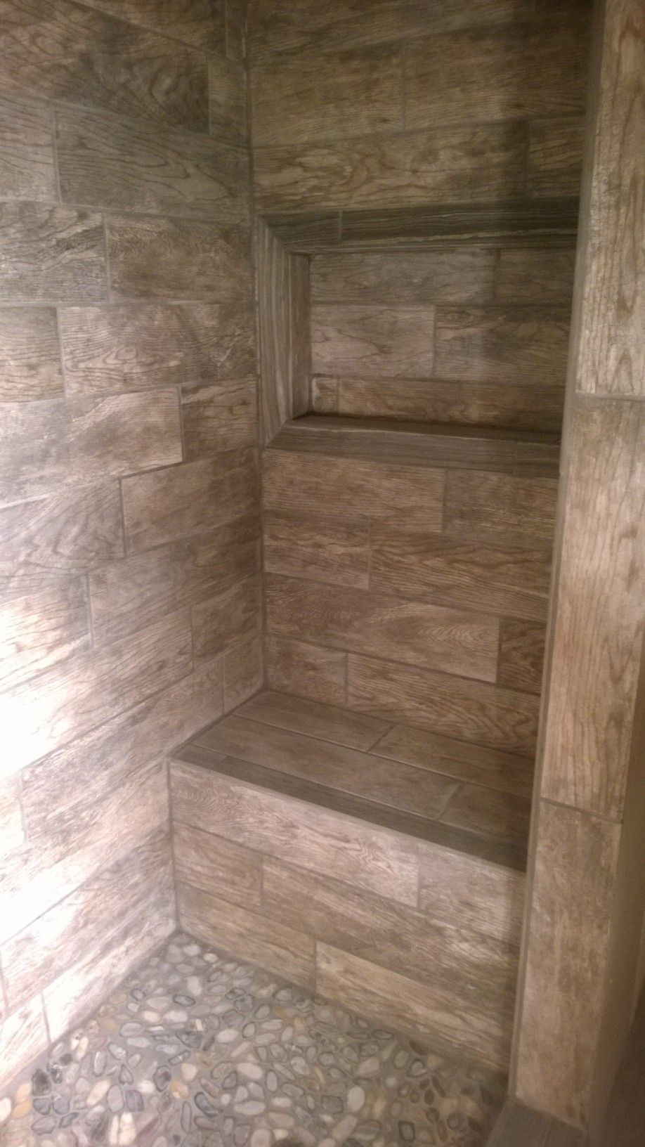 Barnwood Tile Bathroom
 Master Shower with bench and window for soap shampoo