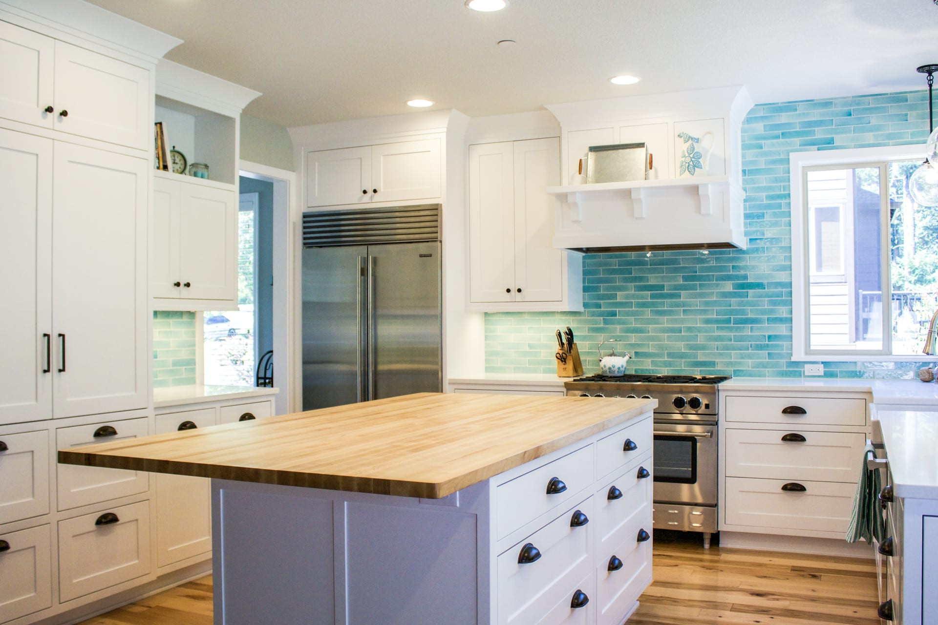 Blue And White Kitchen Tiles
 Custom designed kitchen with white cabinets and bold blue
