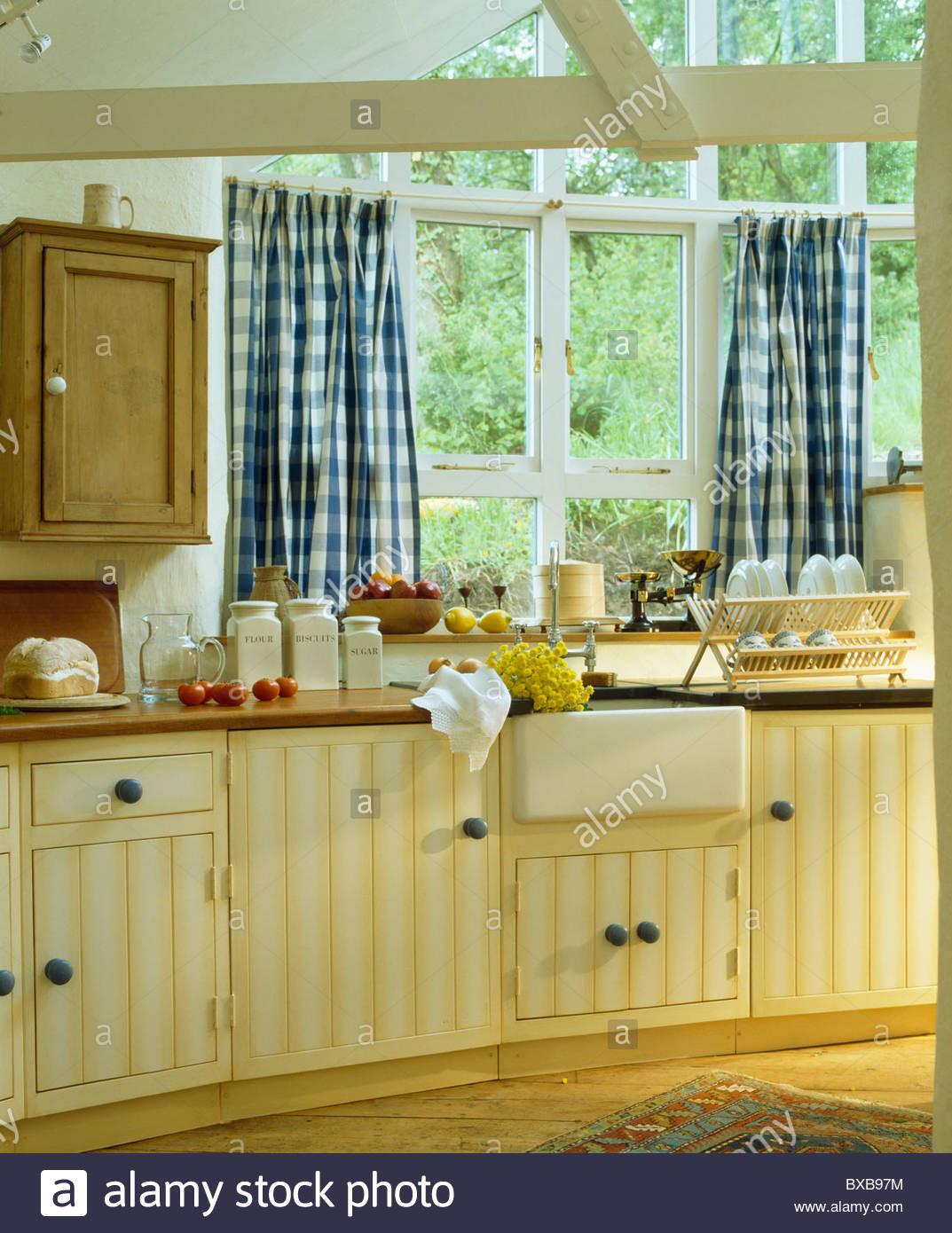 Blue And Yellow Kitchen Curtains
 Blue white checked curtains on window above sink in