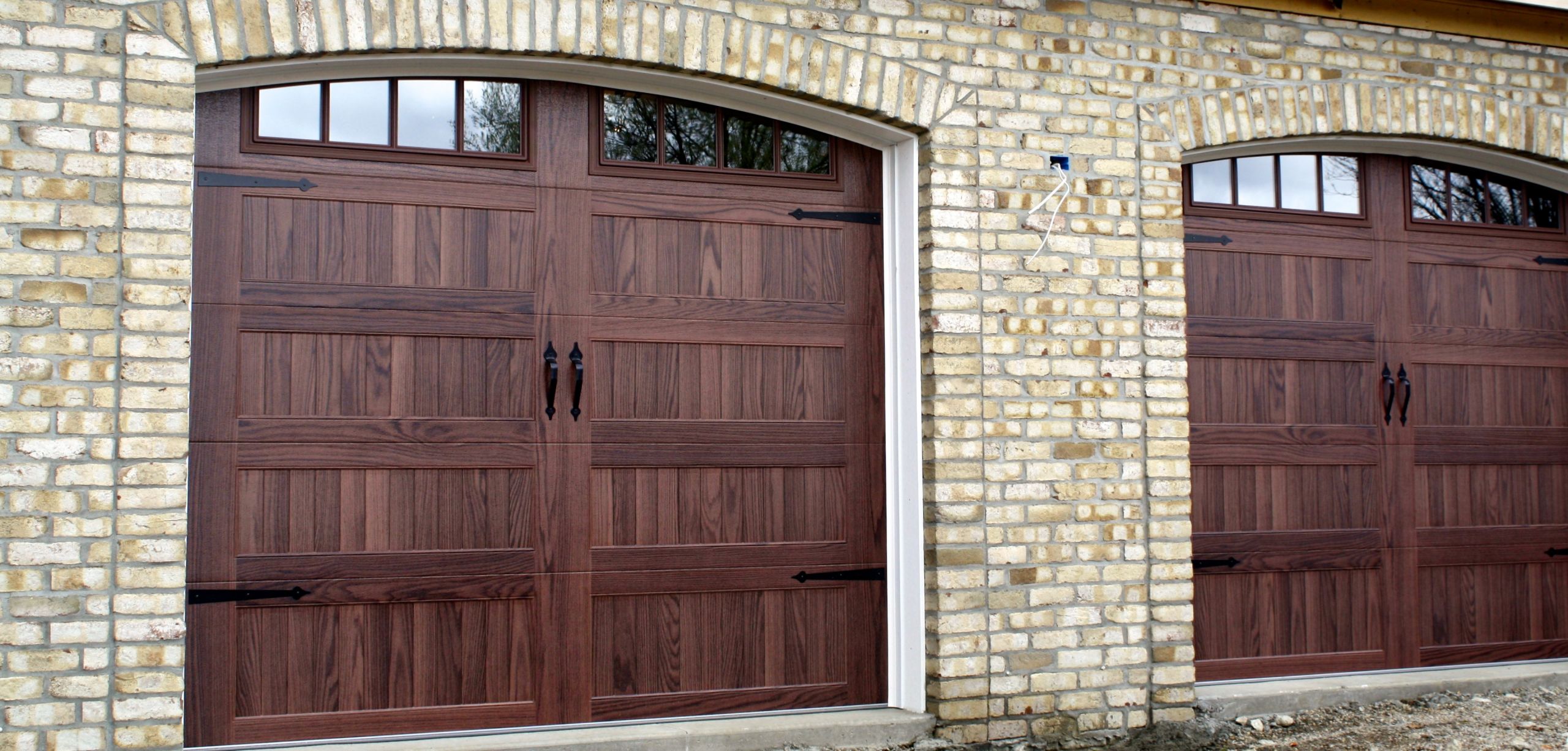 Garage Door Panels
 faux wood arched overhead garage doors in mahogany and