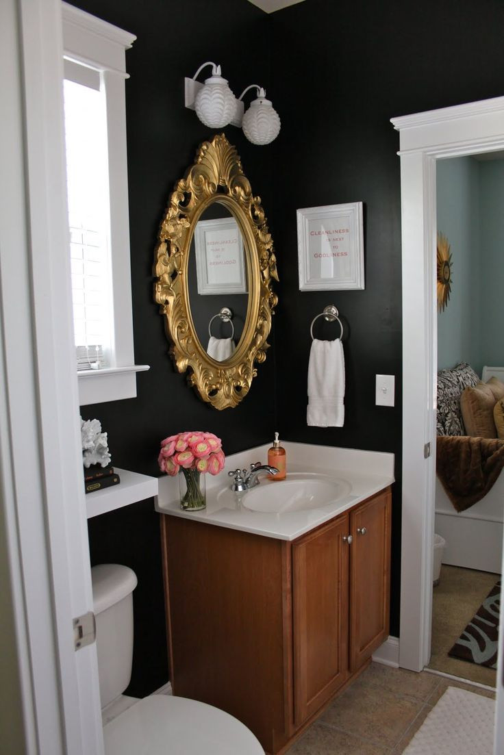 Gold Frame Bathroom Mirror
 Black walls in the bathroom with gold framed mirror