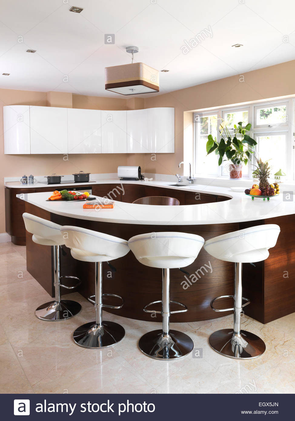 Modern Kitchen Bar Stools
 Bar stools at breakfast bar in modern kitchen UK home