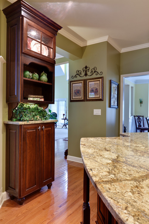 Olive Green Kitchen Walls
 love the green paint with the cherry cabinets will you