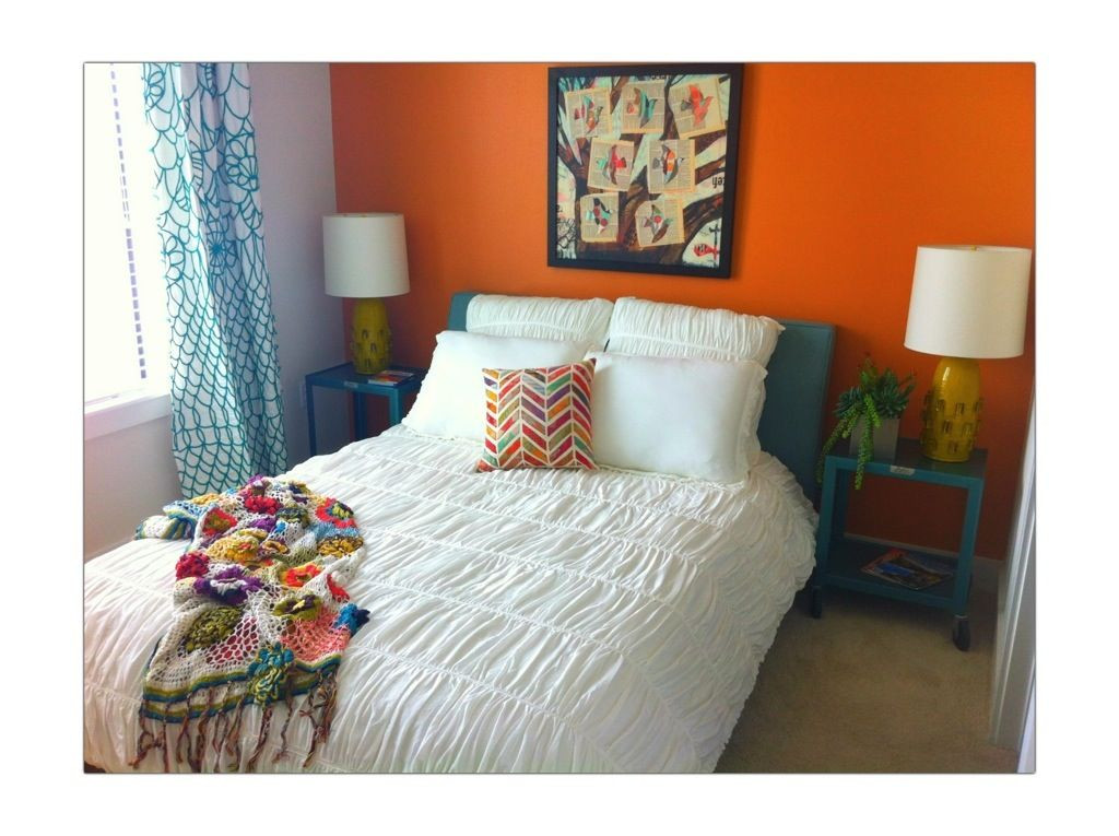 Orange Bedroom Wall
 bright orange bedroom wall with teal accents
