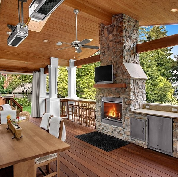 Outdoor Kitchen Designs With Fireplace
 Stone fireplace next to the outdoor kitchen and a lovely