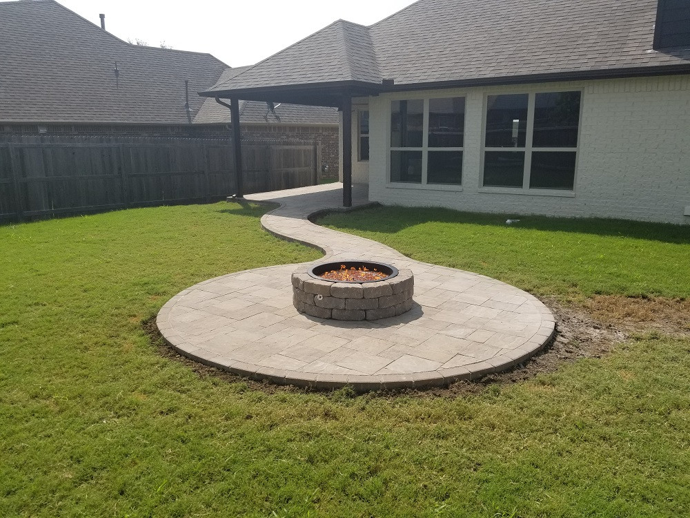 Paver Patio With Fire Pit
 Everything Outdoors Fireplaces and Fire Pits landscaping