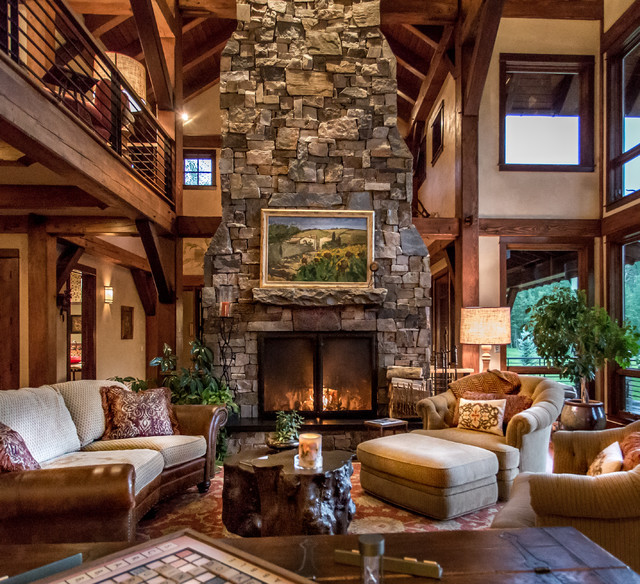 Rustic Living Rooms With Fireplace
 Dramatic wood burning stone fireplace is the living rooms