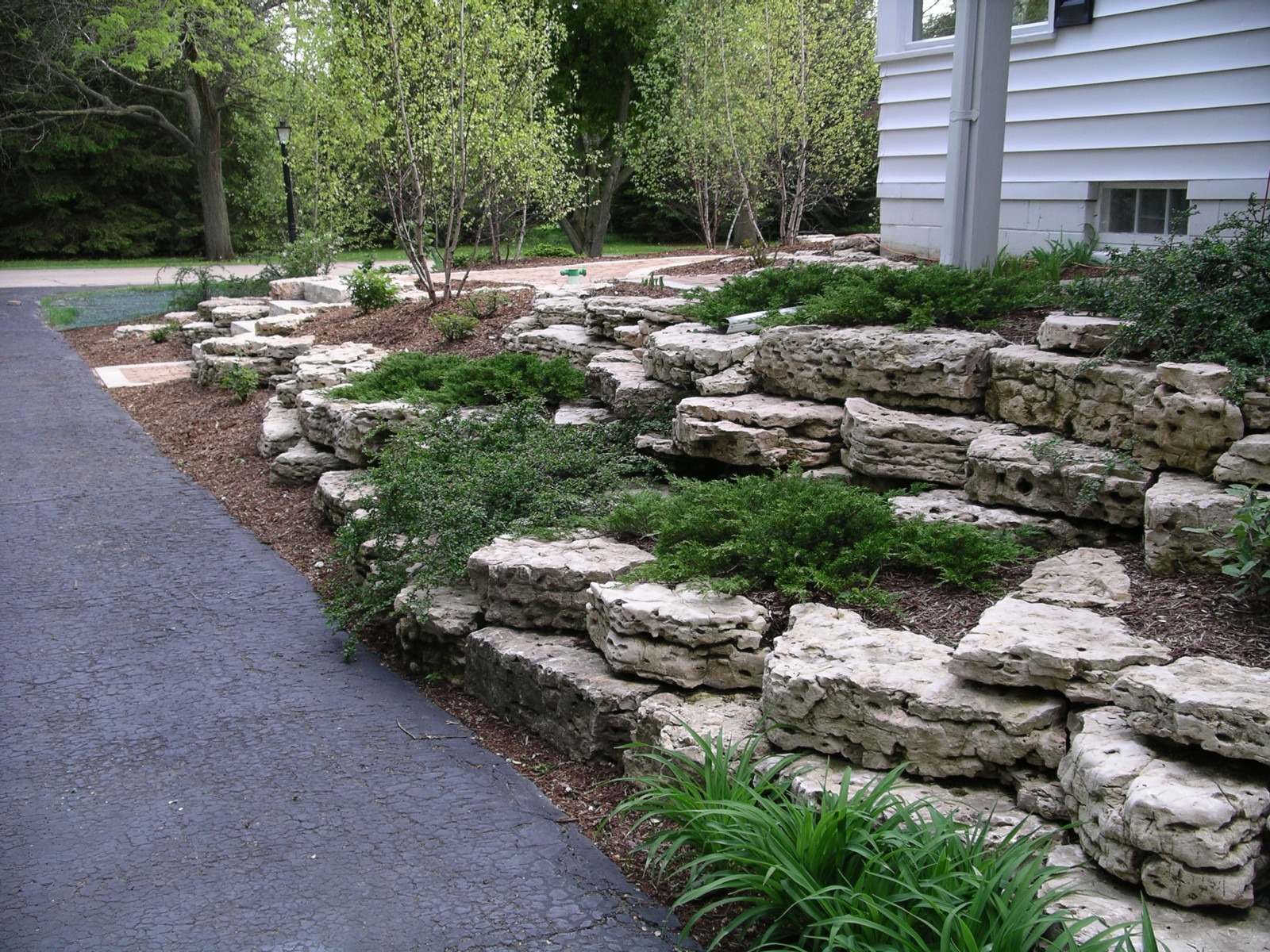 Terrace Landscape With Boulders
 Retaining Walls and Outcroppings Treetops Landscape