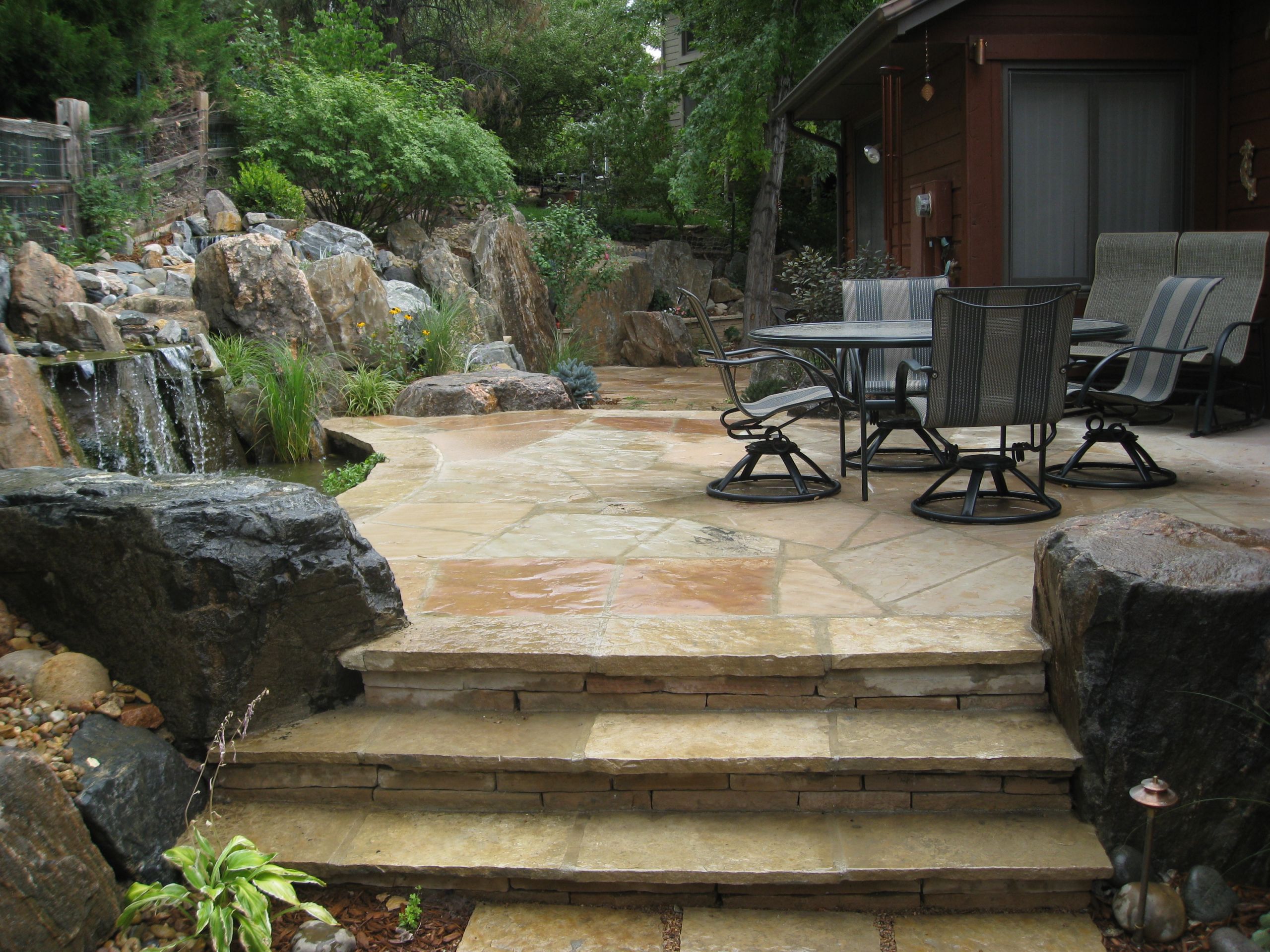 Terrace Landscape With Boulders
 Flagstone Patio and Stairs with Boulders and Naturalistic