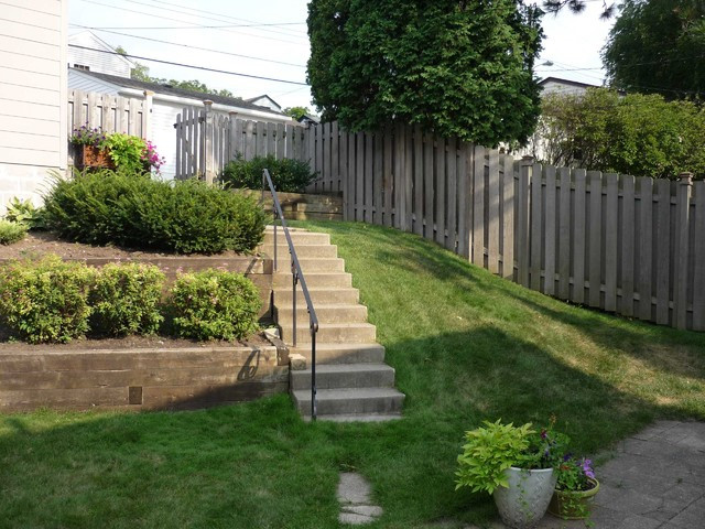 Terrace Landscape With Stairs
 Terraced Backyard with Stairs and Paver Patio
