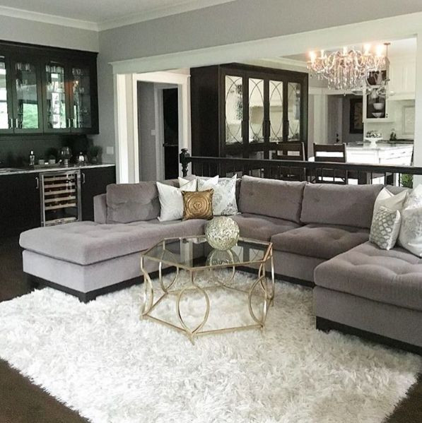 White Living Room Rug
 Gray sectional black built ins and white shag rug