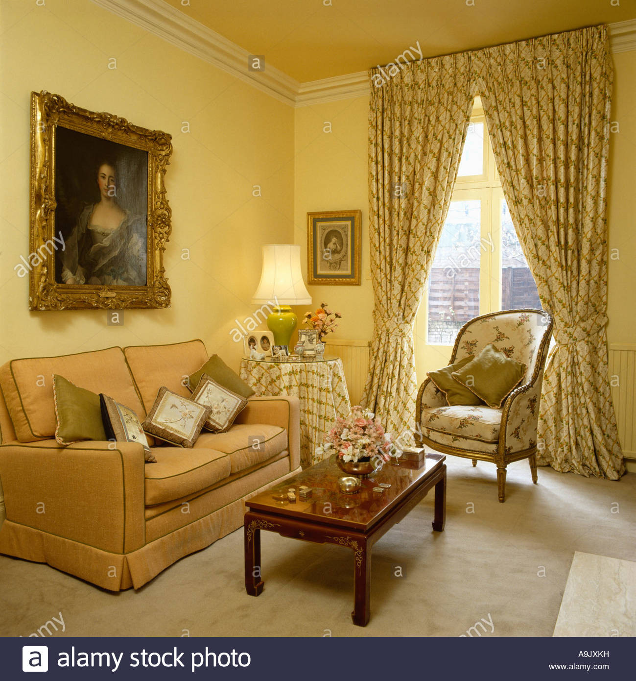 Light Yellow Living Room
 portrait above peach sofa in pale yellow livingroom